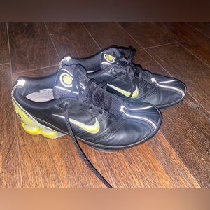 Black and green Nike running shoe